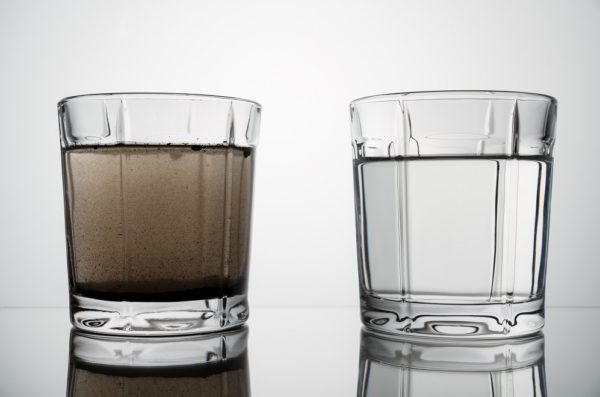 close up glasses with clean and dirty water
